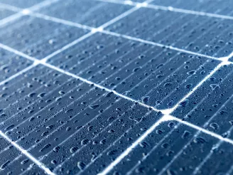 Close Up of the Front of a PV Panel with Raindrops