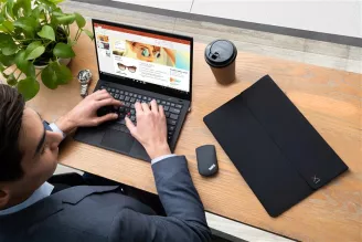 man-working-on-a-desk-with-lenovo-laptop