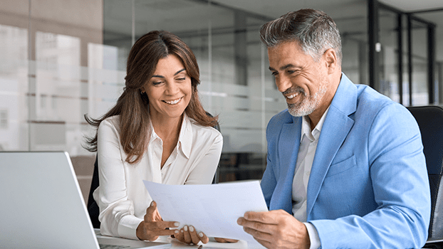 Young woman and middle-aged man look at documents